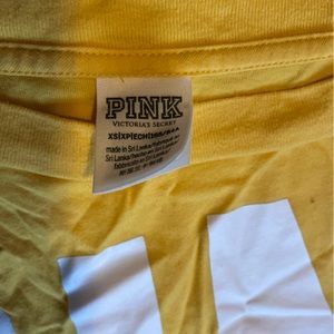 Pink cropped long sleeve tee with mesh on the arms